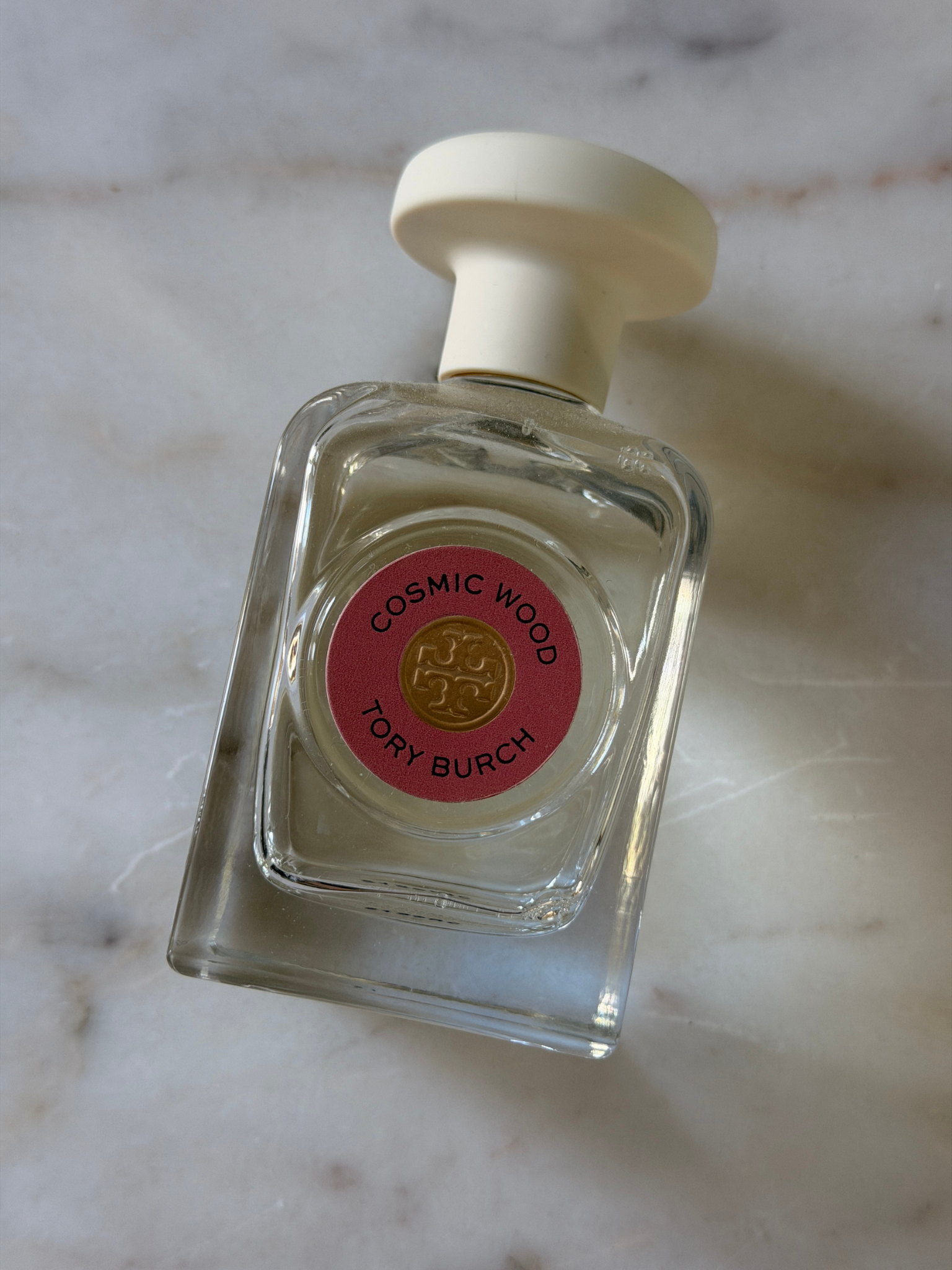 A bottle of Tory Burch Cosmic Wood