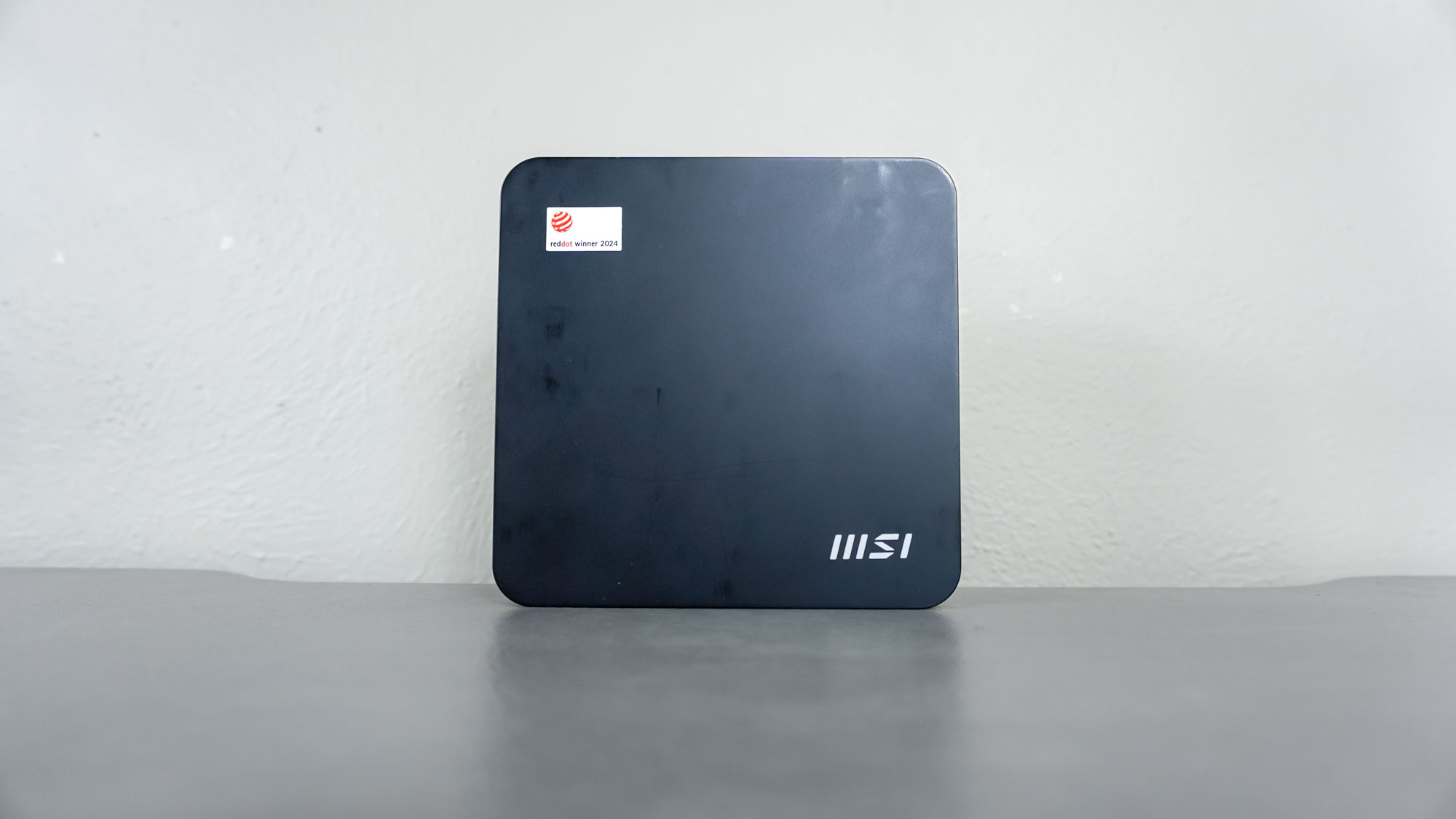 The MSI Cubi NUC 1M mini PC upright on a desk