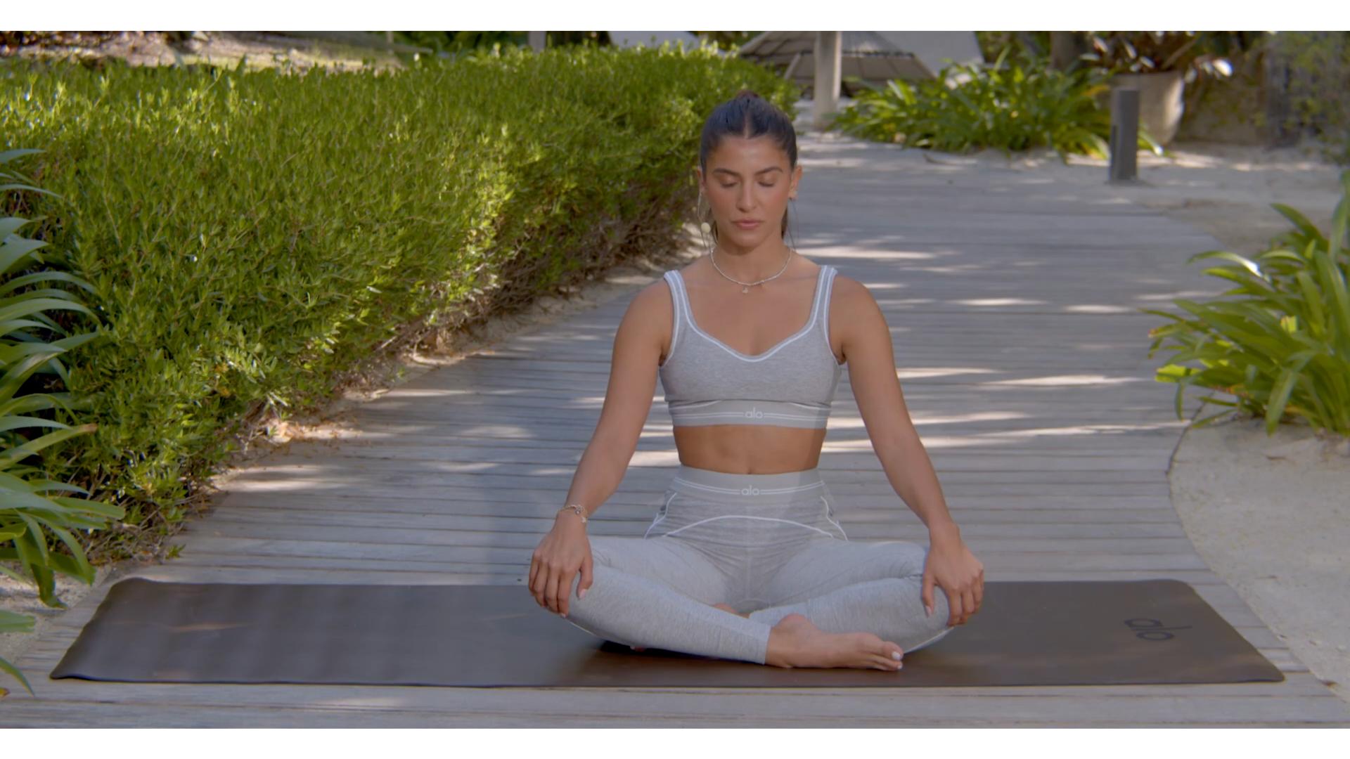 woman does yoga outdoors