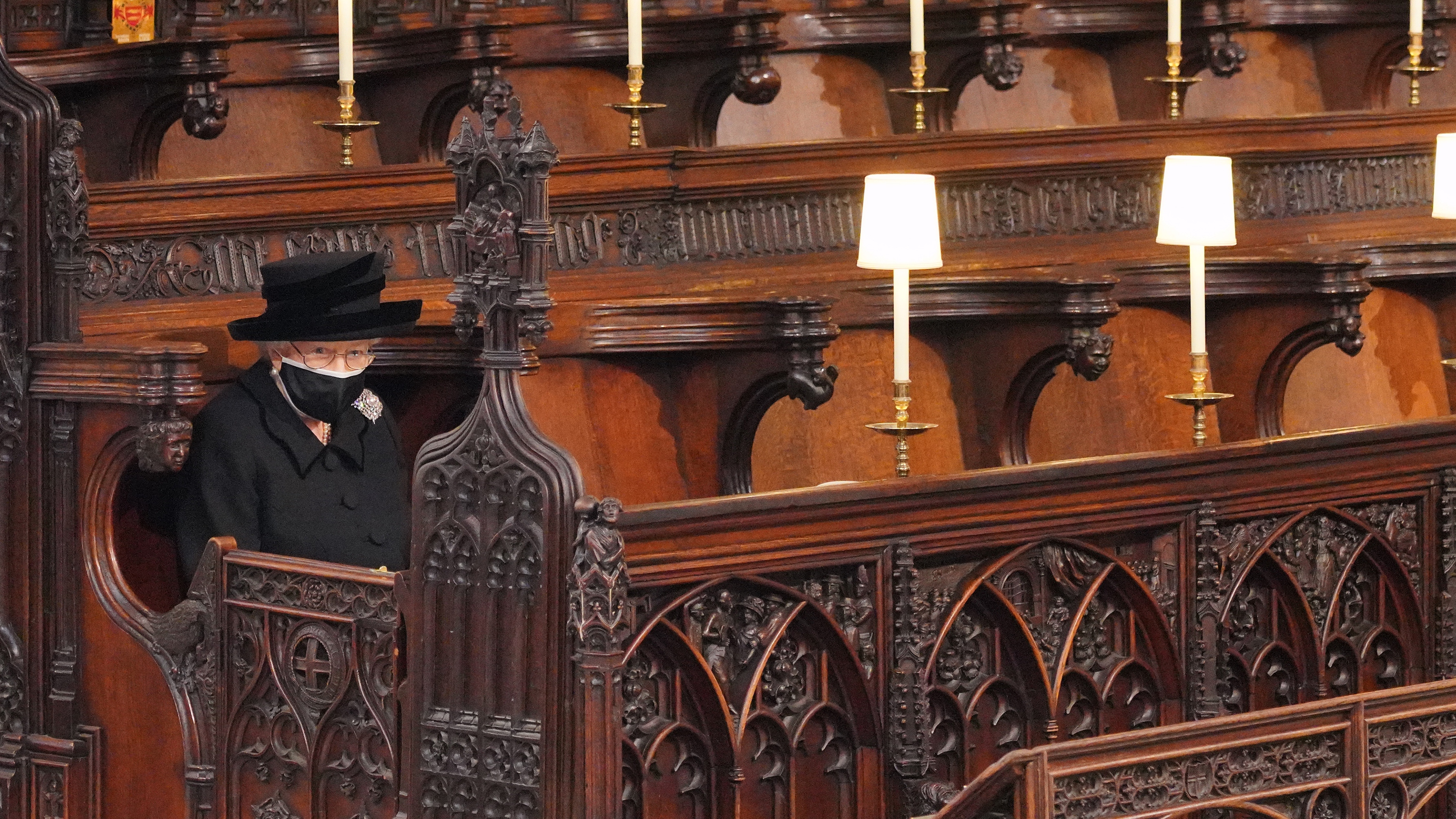 Queen Elizabeth II takes her seat during the funeral of Prince Philip, Duke of Edinburgh in St George's Chapel at Windsor Castle on April 17, 2021