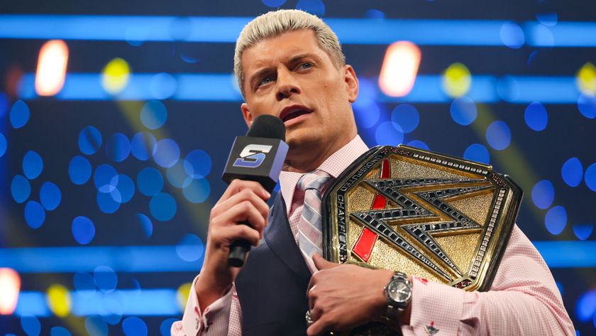 Cody Rhodes talks to the crowd with the WWE Championship Belt over his shoulder.