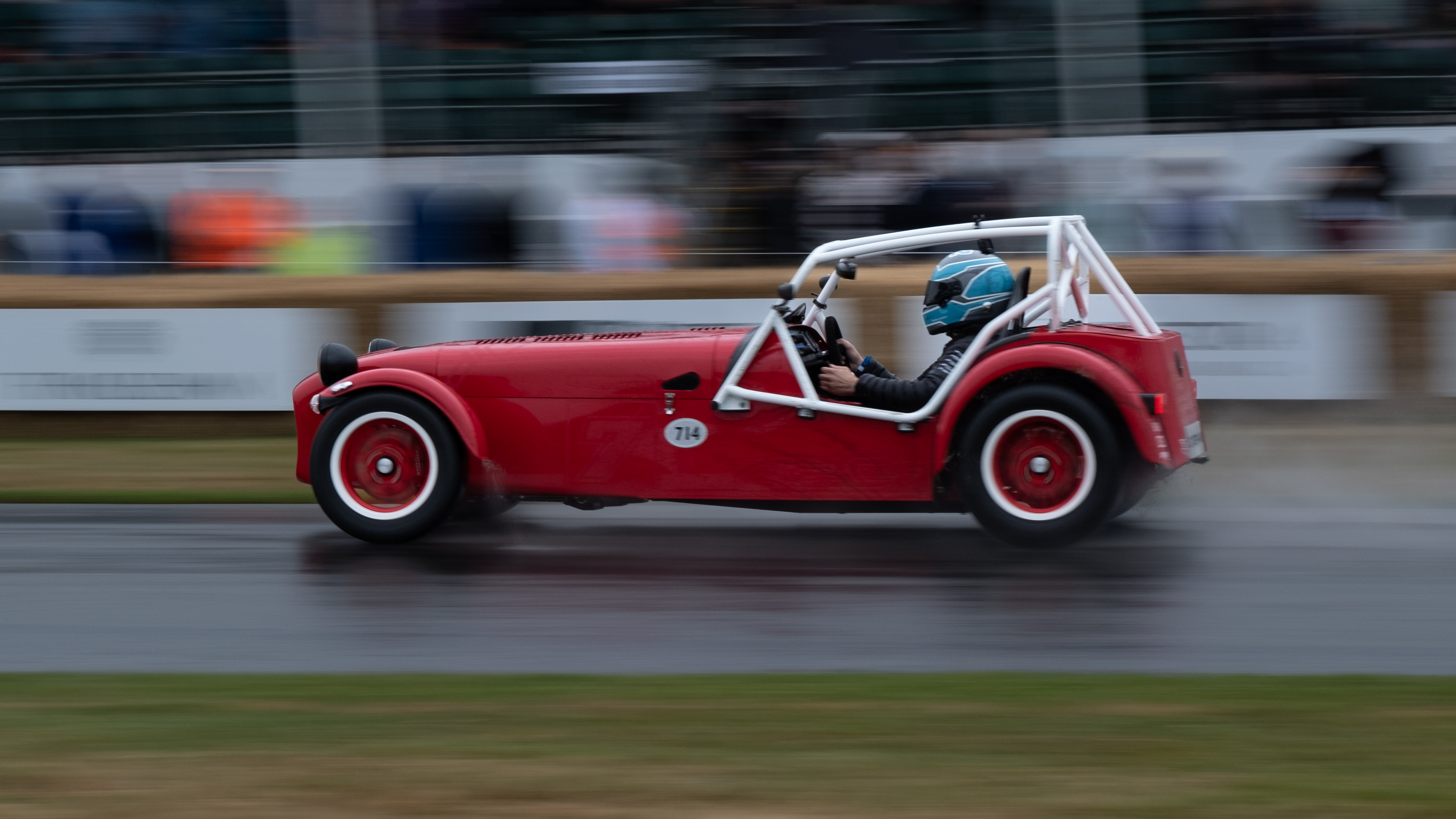 A car racing on as track at Goodwood