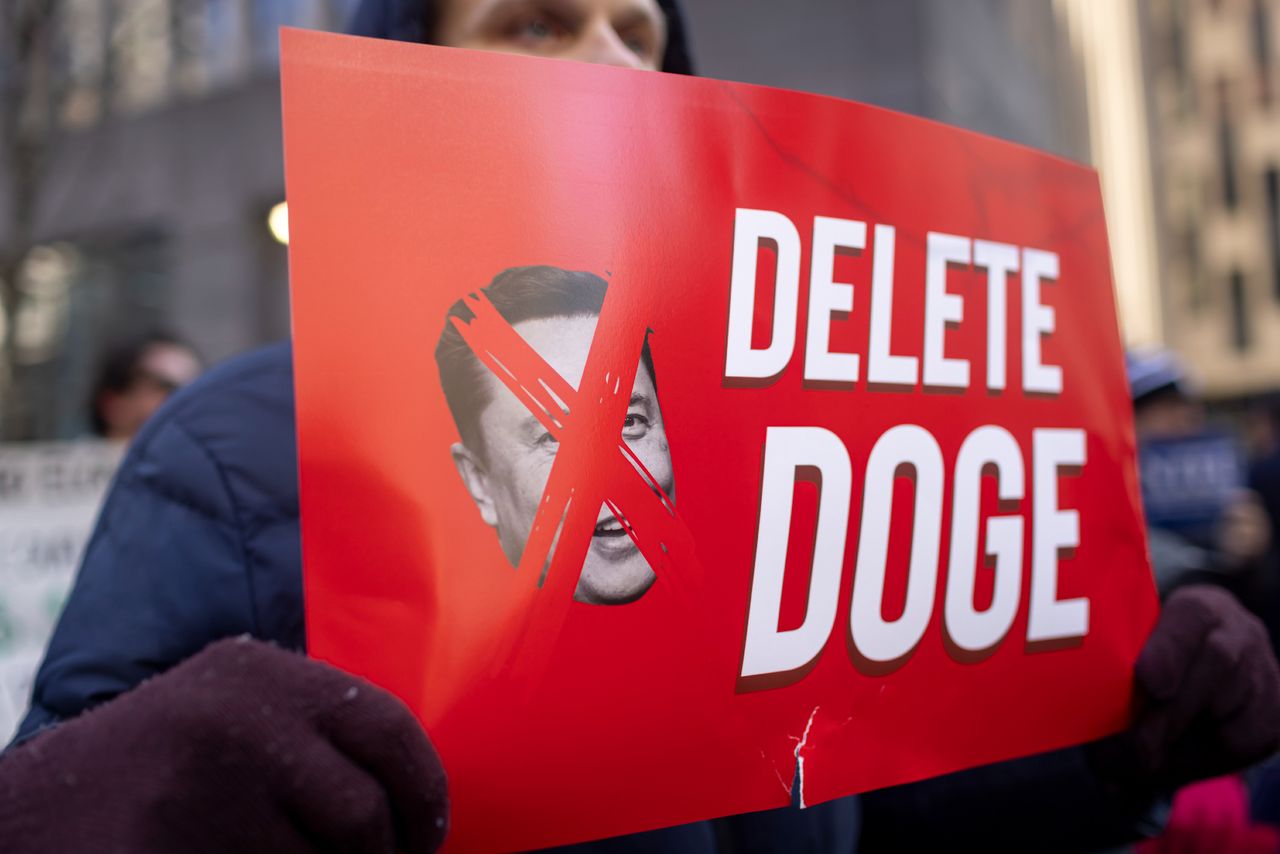 NEW YORK CITY, NEW YORK, UNITED STATES - 2025/02/19: Federal workers and protestors speak out against U.S. President Donald Trump and Elon Musk, the tech billionaire, who is leading the so-called Department of Government Efficiency (DOGE), and their push to gut federal services and impose mass layoffs. Protests have spread in cities across the nation against the Trump administration&#039;s freezing of federal funds, mass layoffs, and a disregard of union contracts. 