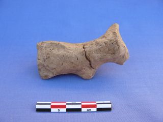 clay figurine found at chogha golan iran