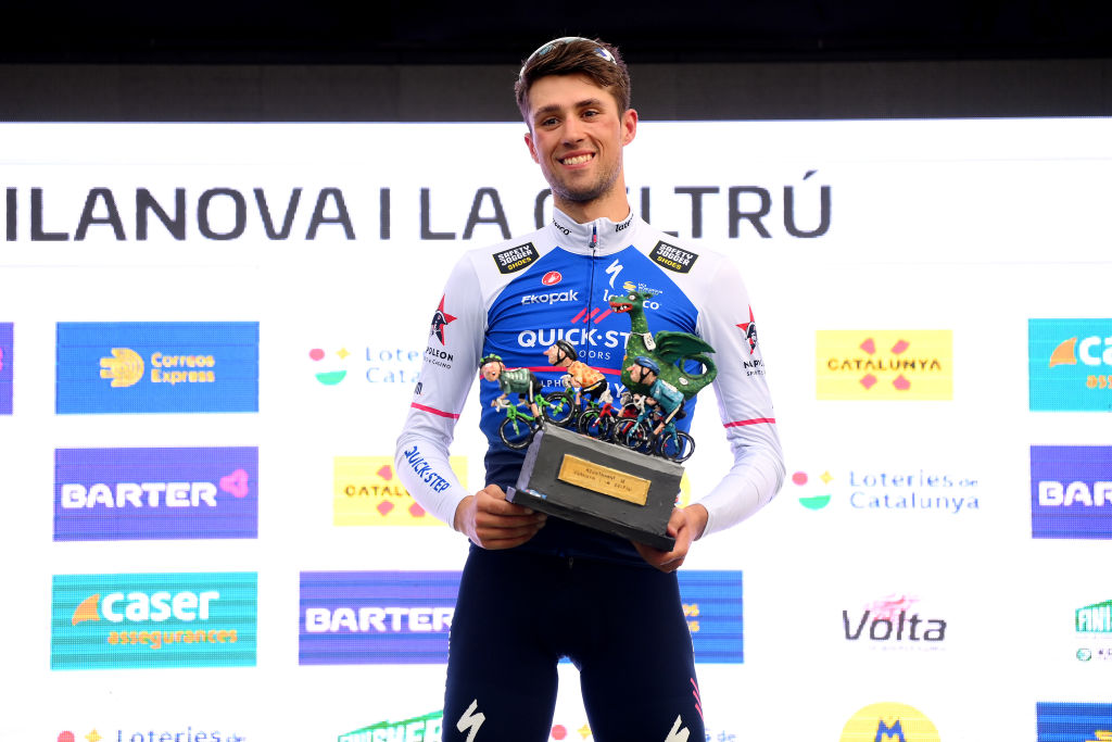 VILANOVA I LA GELTRU SPAIN MARCH 25 Ethan Vernon of United Kingdom and Team QuickStep Alpha Vinyl celebrates winning the stage on the podium ceremony after the 101st Volta Ciclista a Catalunya 2022 Stage 5 a 2063km stage from La Pobla de Segur to Vilanova i la Geltr VoltaCatalunya101 WorldTour on March 25 2022 in Vilanova i la Geltru Spain Photo by David RamosGetty Images