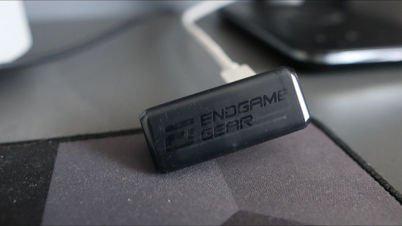 An Endgame Gear OP1w 4K gaming mouse on a desk.