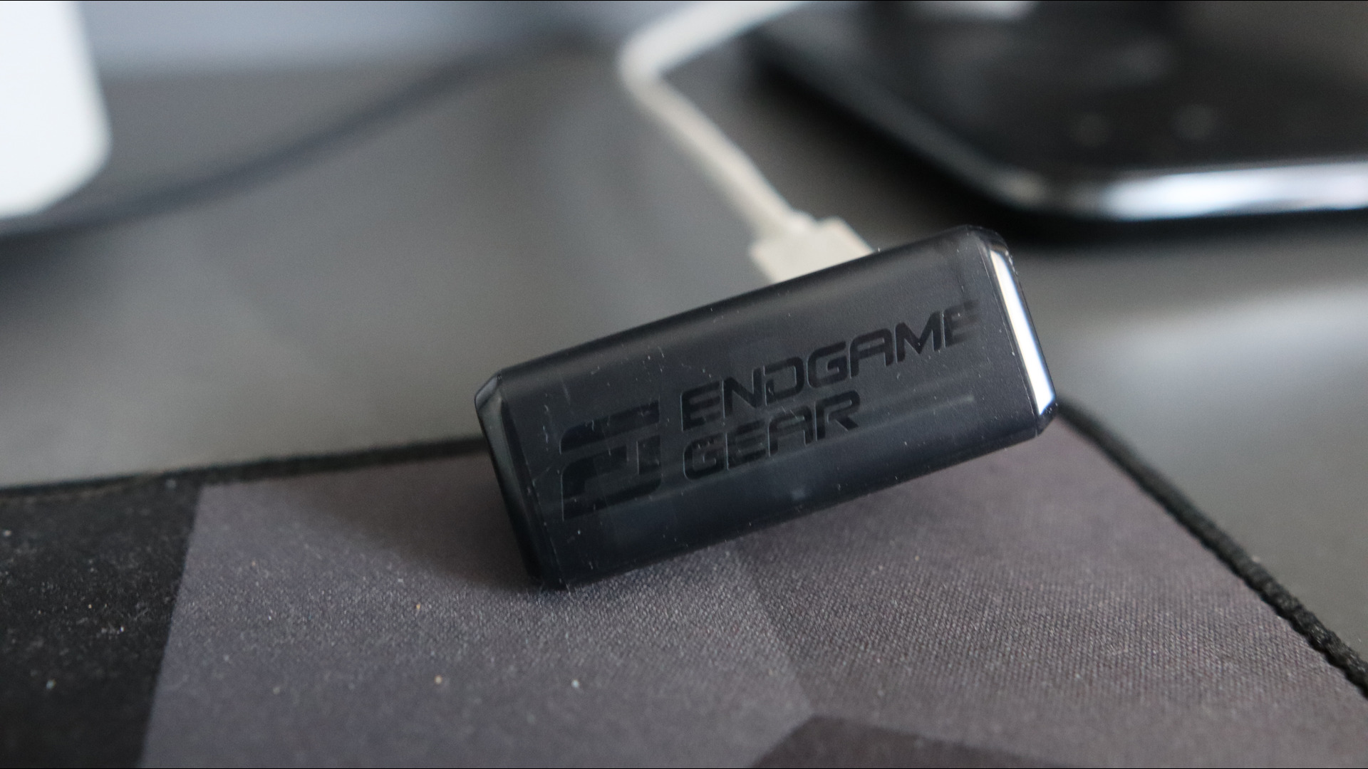 An Endgame Gear OP1w 4K gaming mouse on a desk.