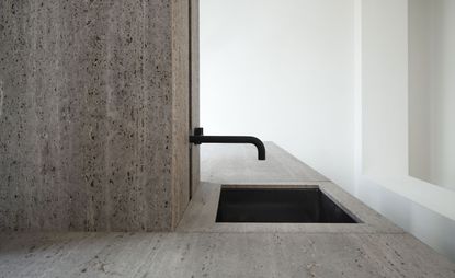 Belgian architect Glenn Sestig has yet again conjured up magic with natural stone travertine titanium, this time transforming it into a 'Signature Kitchen' for Obumex