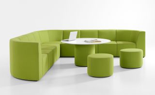 Green sectional sofa and white table by Bernhardt Design