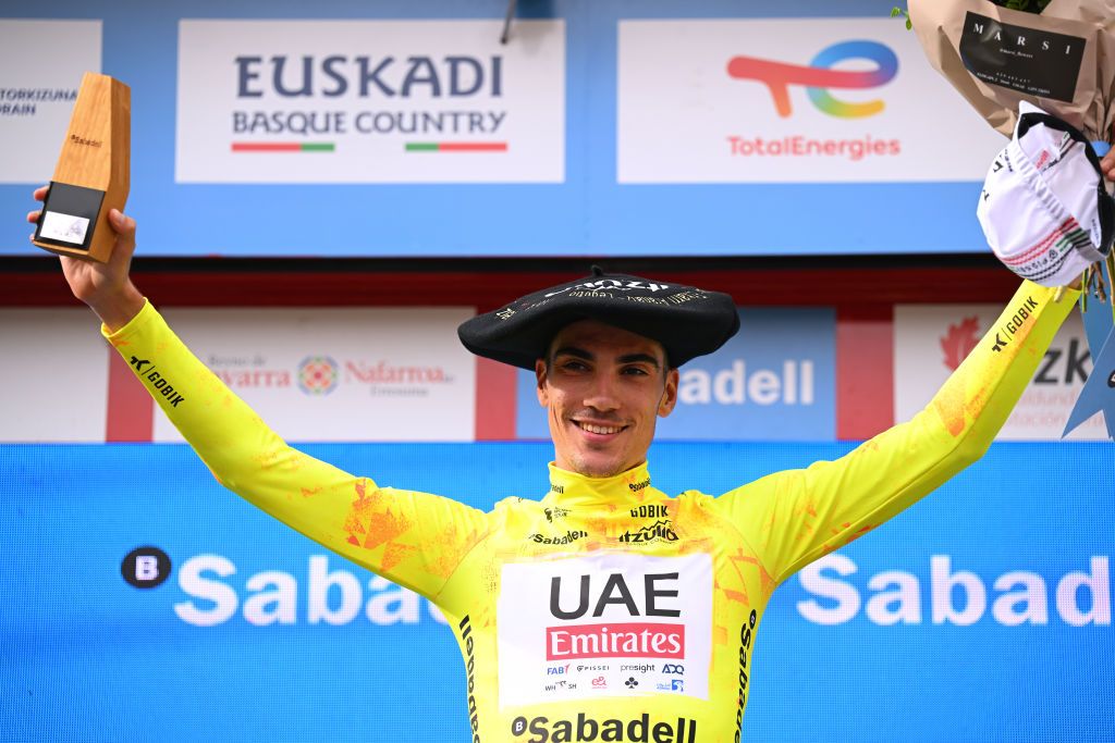 EIBAR SPAIN APRIL 06 Juan Ayuso of Spain and UAE Team Emirates celebrates at podium as Yellow Leader Jersey and overall final race winner with the Txapela hat Trophy during the 63rd Itzulia Basque Country 2024 Stage 6 a 1378km stage from Eibar to Eibar UCIWT on April 06 2024 in Eibar Spain Photo by Tim de WaeleGetty Images