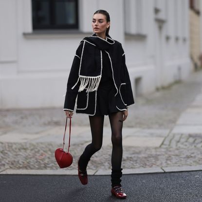 woman wearing valentine's day outfit - alaia bag and alohas shoes from the article