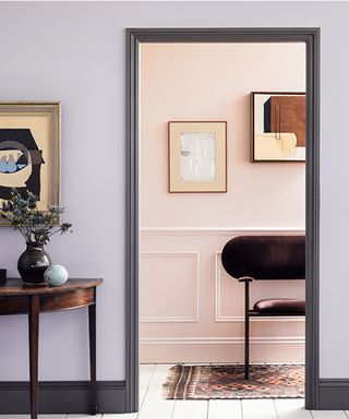 lilac hallway with grey woodwork and pink panelled adjoining room