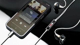 Questyle NHB12 plugged into iPhone