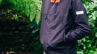 Albion Zoa rain jacket being worn with hands in the pockets