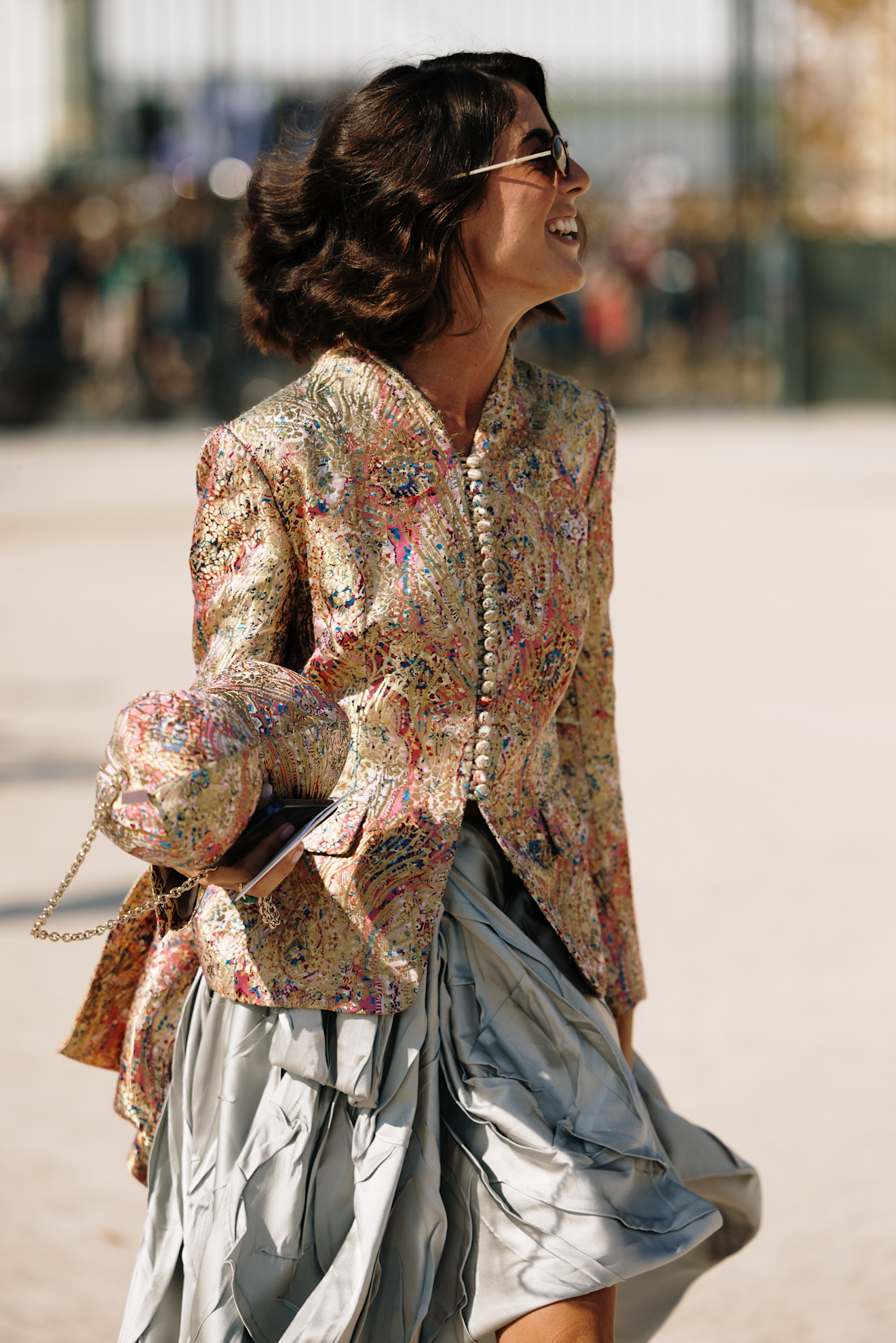 woman wearing brocade jacket and skirt