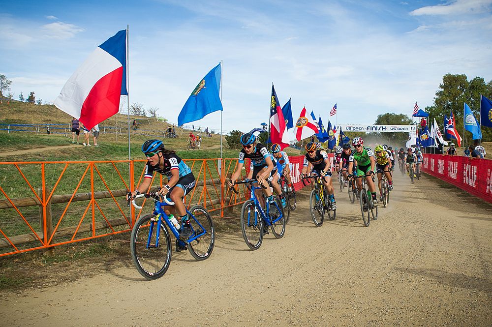 The start of the elite women's race with Caroline Mani (Raleigh Clement) going for the hole shot.
