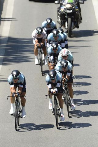 An Omega Pharma Quick Step rider swings off