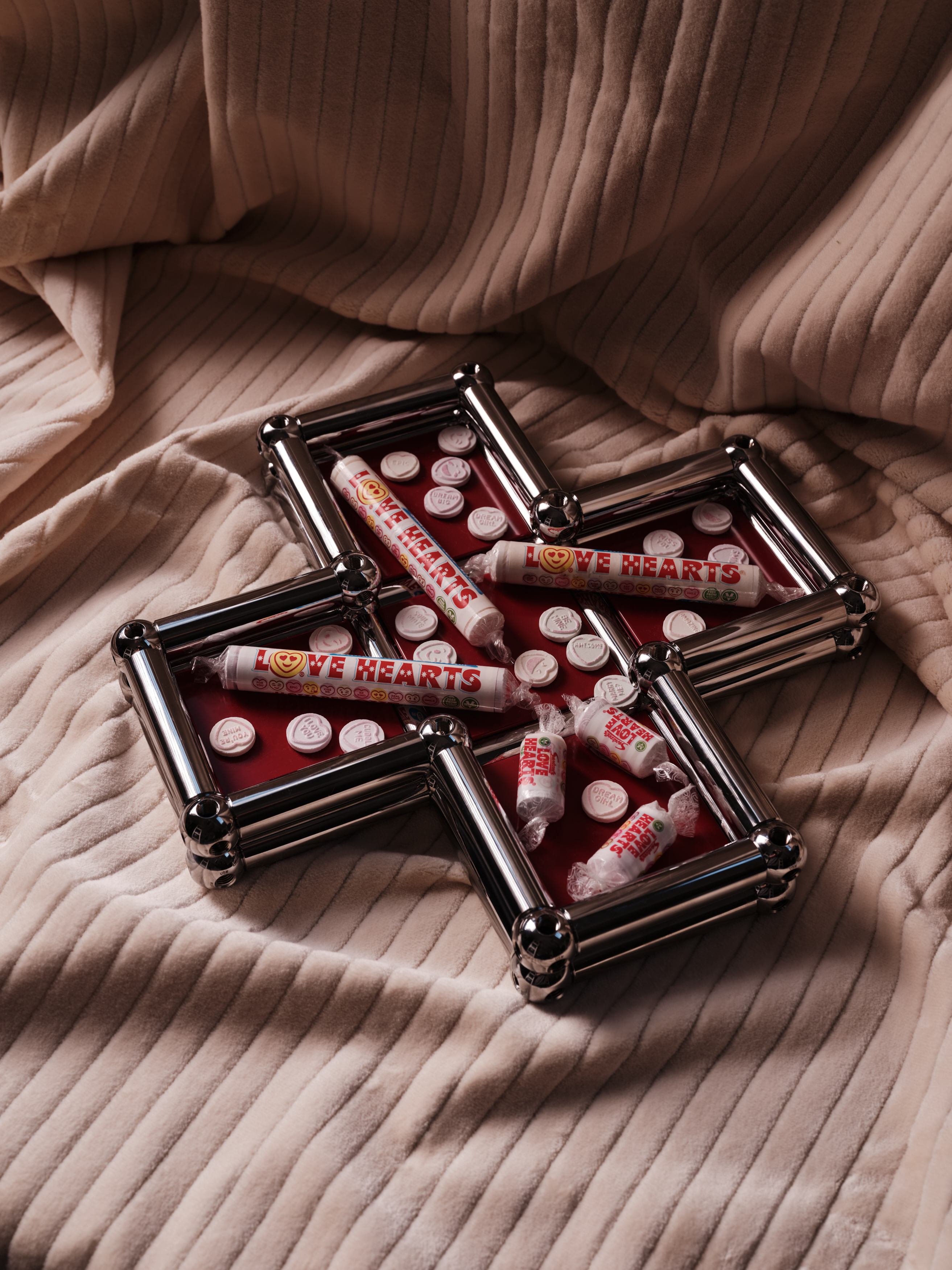 A series of shots depicting a festive Christmas tree, flowers, candles, and accessories setup.