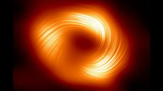 A view of a fiery ring against a black background. There are streaks on the ring.