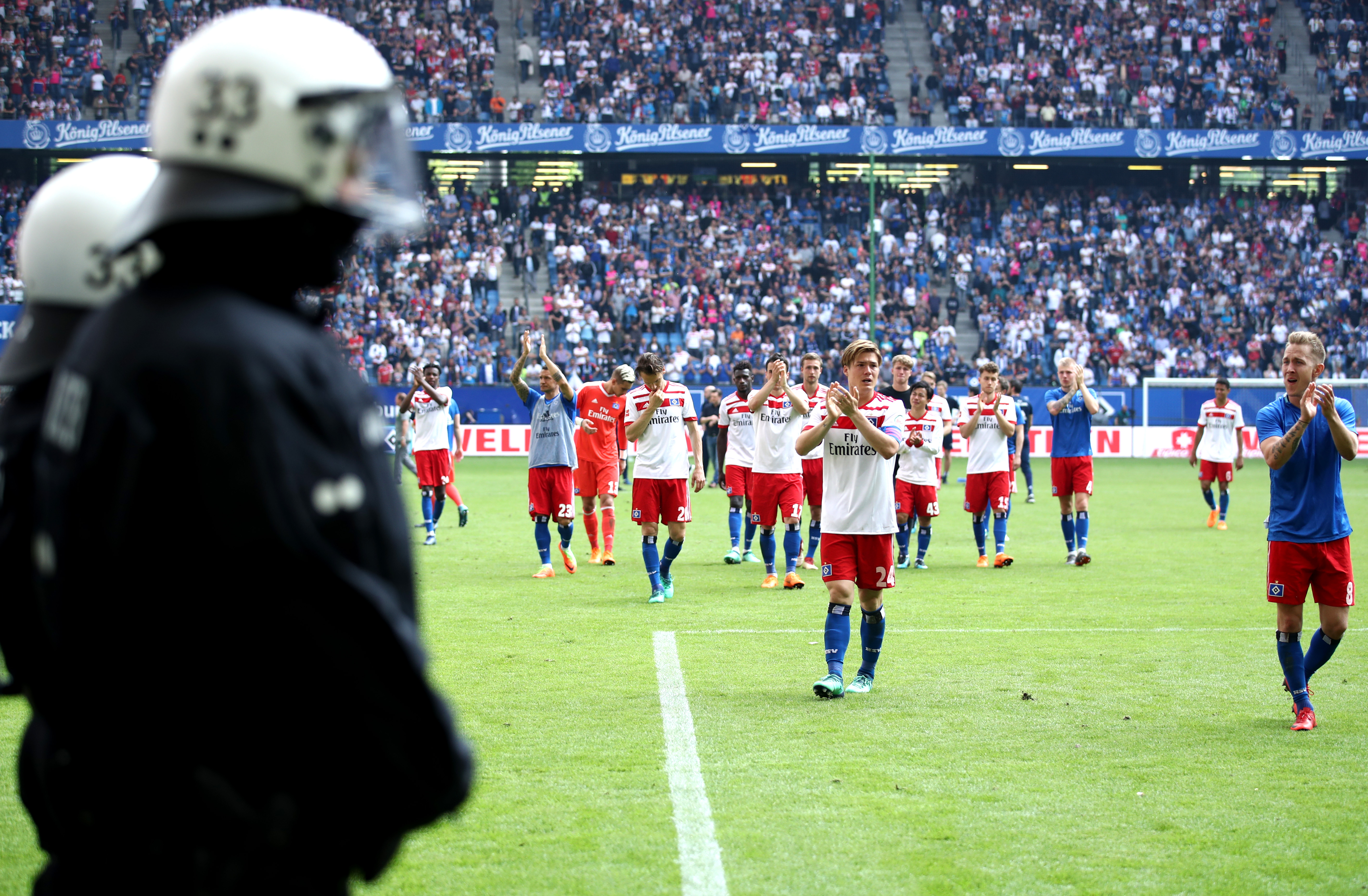 Hamburg players applaud their fans after relegation from the Bundesliga following a game against Borussia Monchengladbach in May 2018.