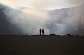 A snapshot of Aldo Kane and Ken Sims, of the University of Wyoming, on an expedition to collect lava samples from Mount Nyiragongo, in the Democratic Republic of the Congo. This image was taken during the filming of National Geographic's new documentary series "One Strange Rock."