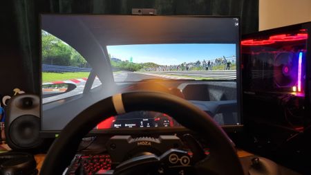 A drivers eye-view of the MOZA R5 being used for some sim racing, with a terrible driver behind the wheel