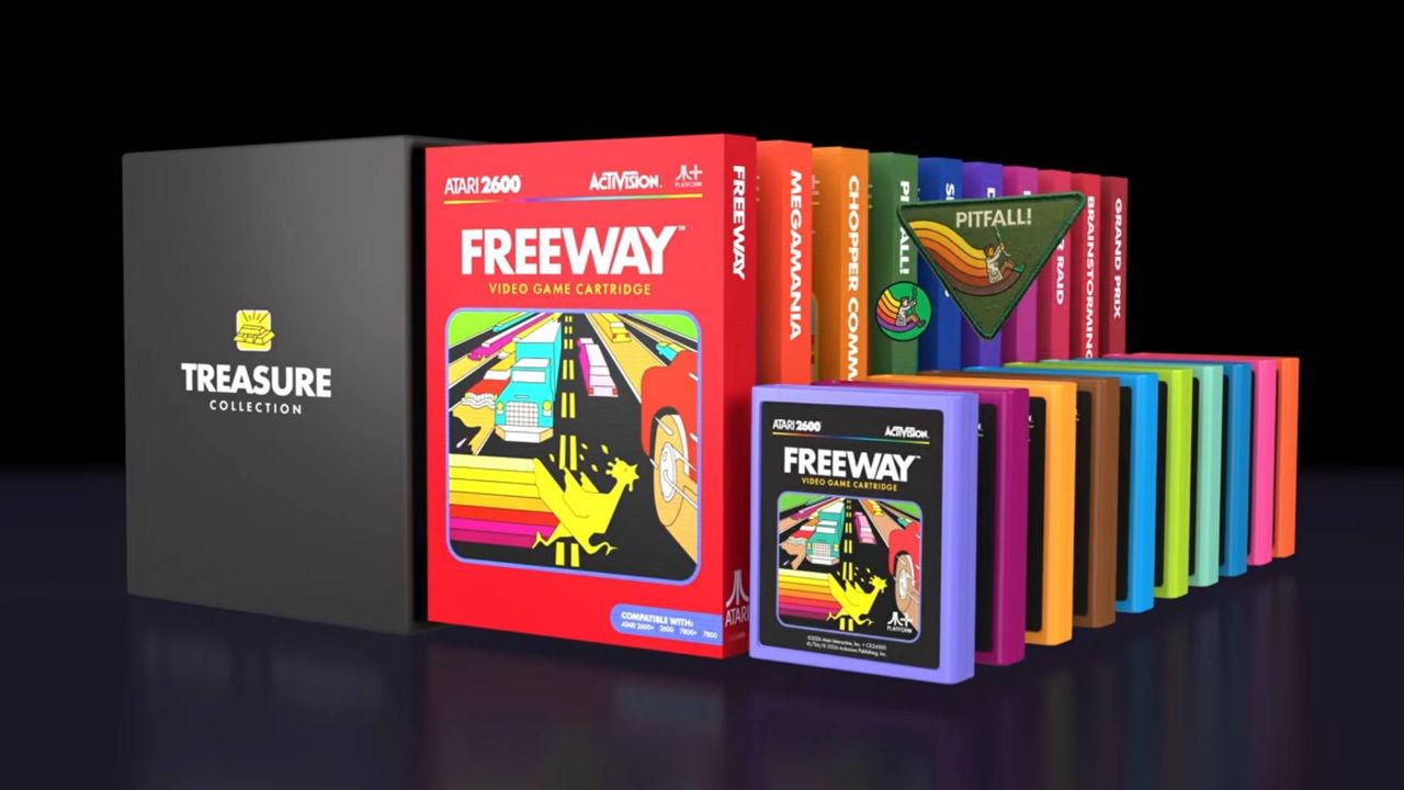 Atari x Activision collection Deluxe "Treasure" edition with boxes lined up next to carts and Pitfall patch and badge.