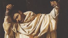 Saint Serapion hanging limp in chains