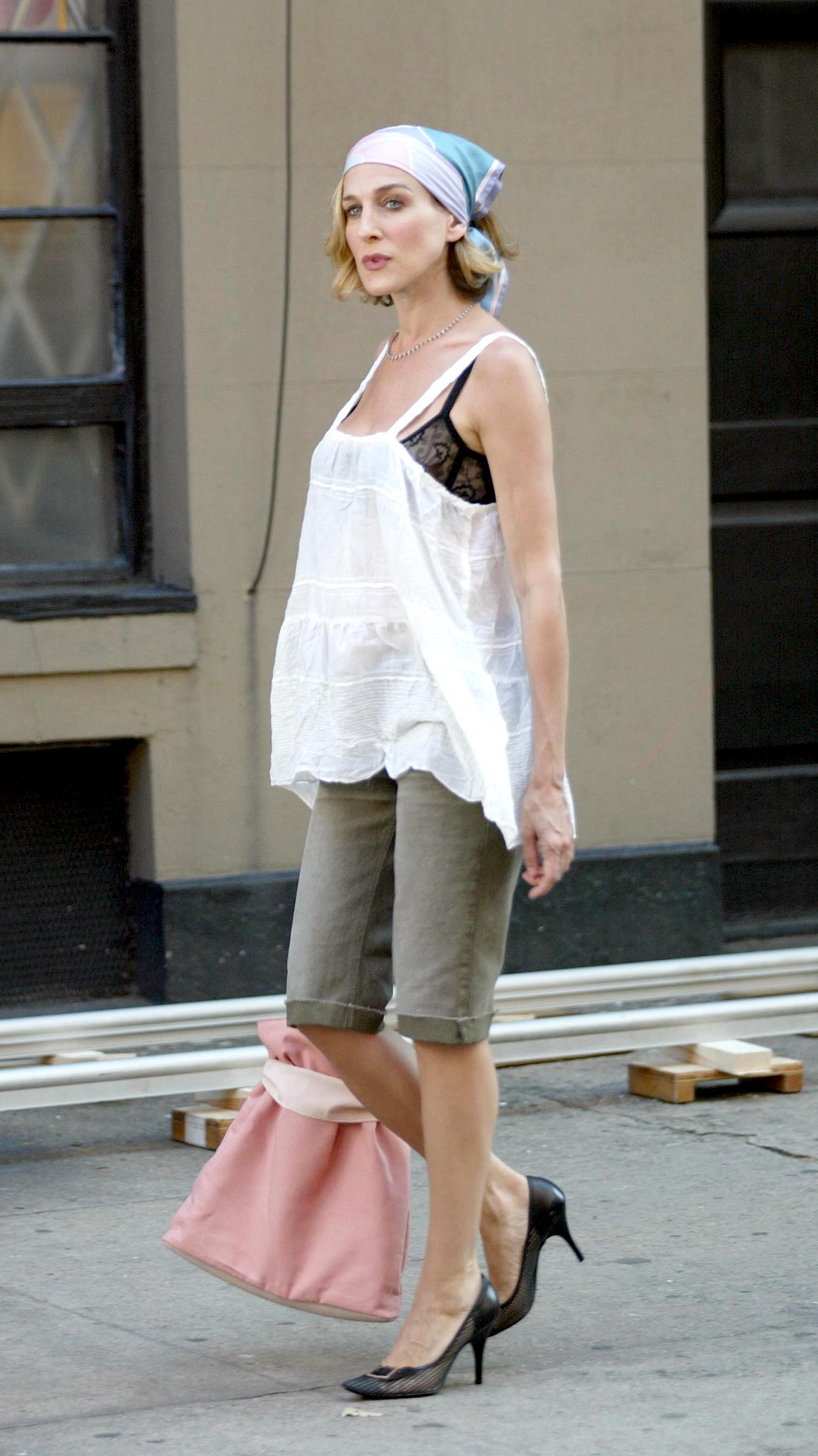 Sarah Jessica Parker as Carrie Bradshaw styles denim pedal pushers with floaty layers