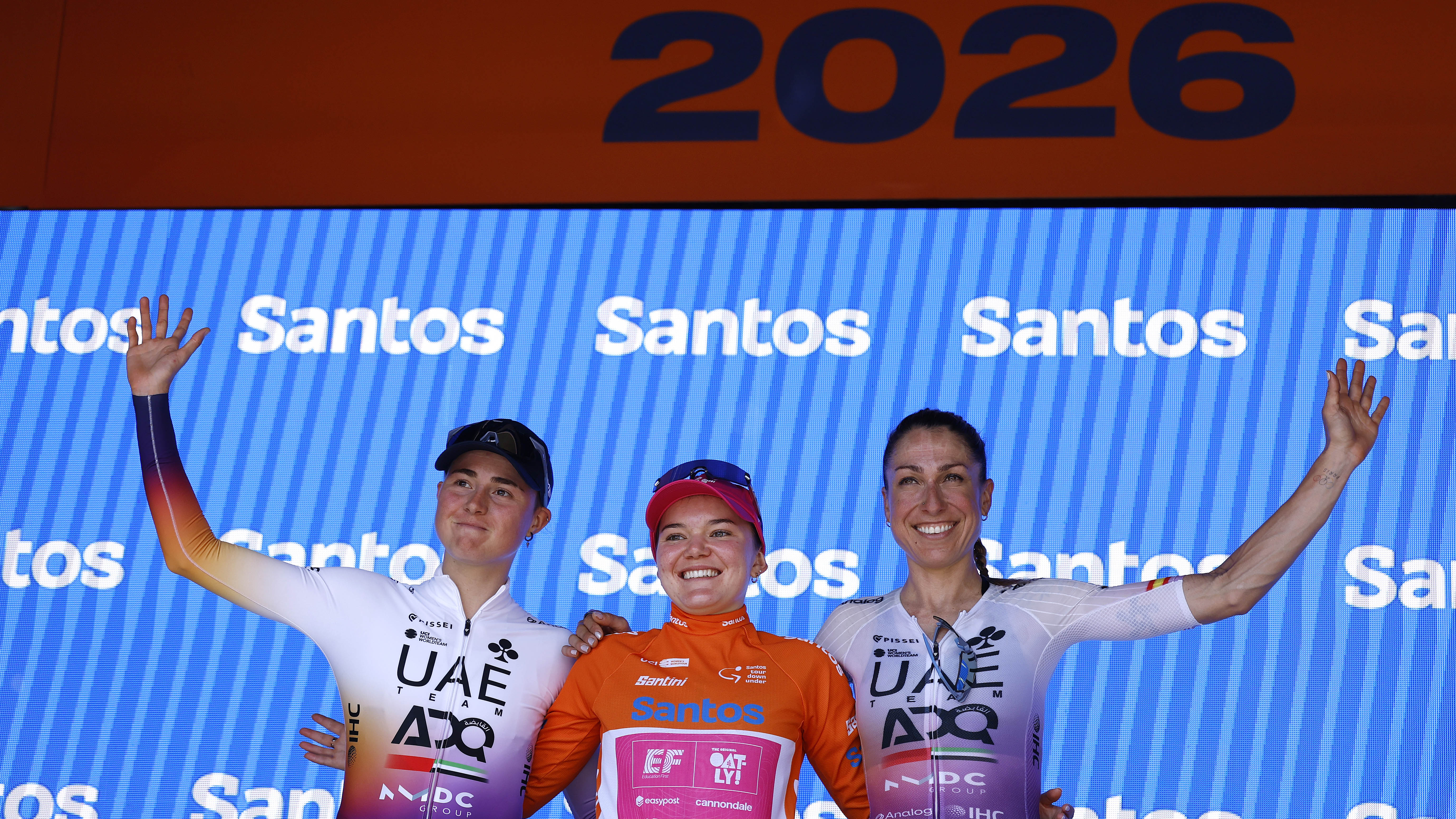(L-R) Paula Blasi of Spain and UAE Team ADQ on 3rd place, race winner Noemi Ruegg of Switzerland and Team EF Education-Oatly - Orange Santos Leader's Jersey and Mavi Garcia of Spain and UAE Team ADQ