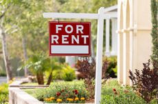 A home with a For Rent sign out front