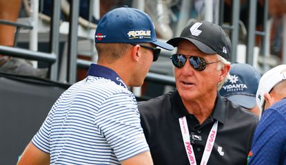 Greg Norman and Talor Gooch chat on the tee