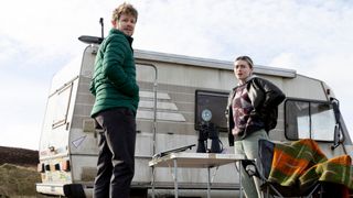 Rev Alan Calder and Lisa Friel looking worried by a campervan in Shetland season 9 episode 3