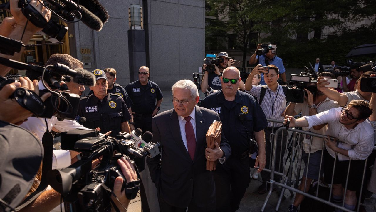 Senator Robert Menendez, a Democrat from New Jersey, center, exits federal court in New York