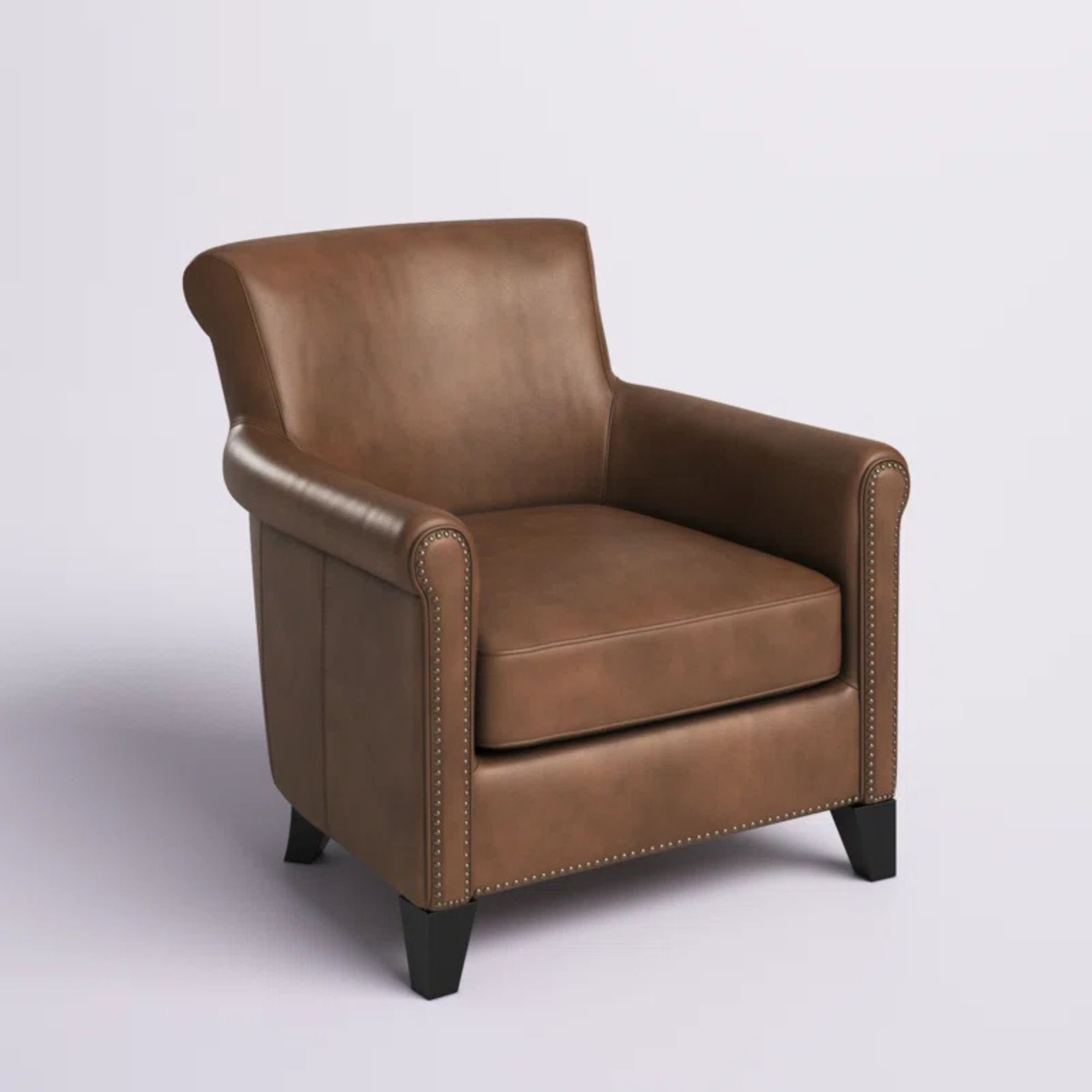 brown leather armchair with nailhead trim