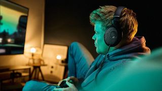 Sennheiser HD 550 headphones being worn while playing games