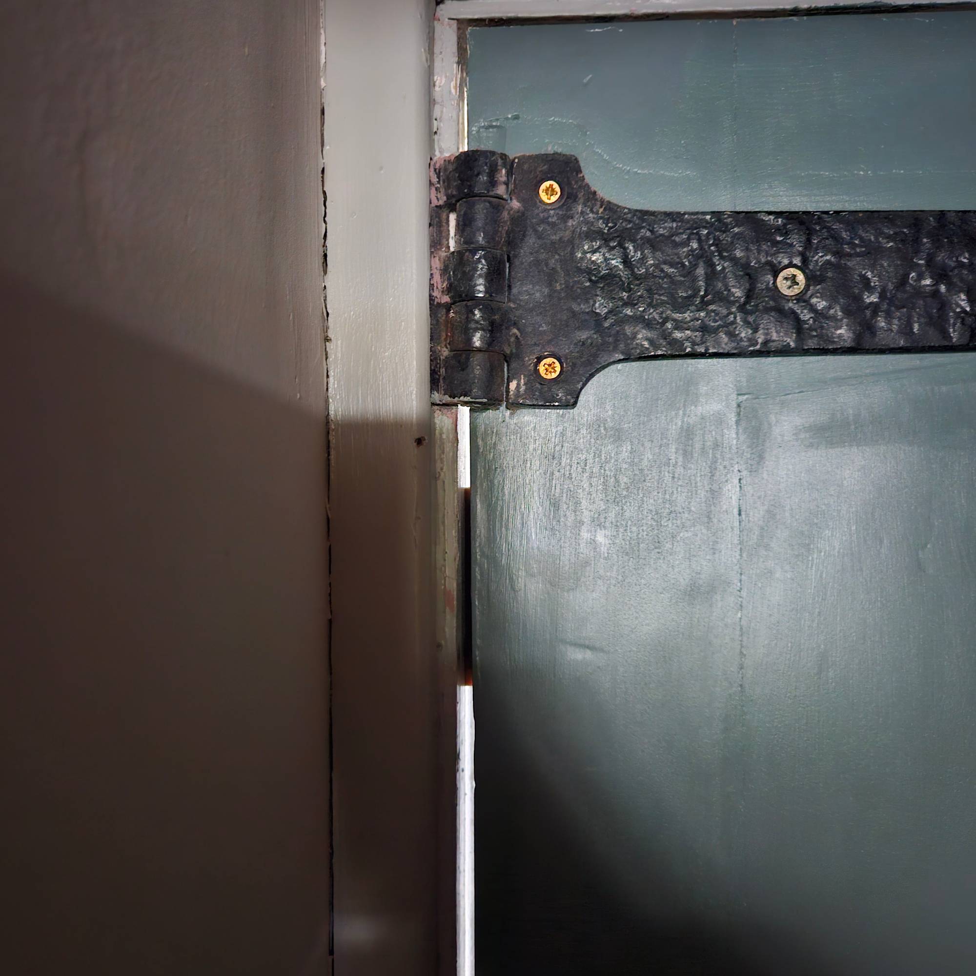 small piece of draught excluder tape blocking up gap between frame and door