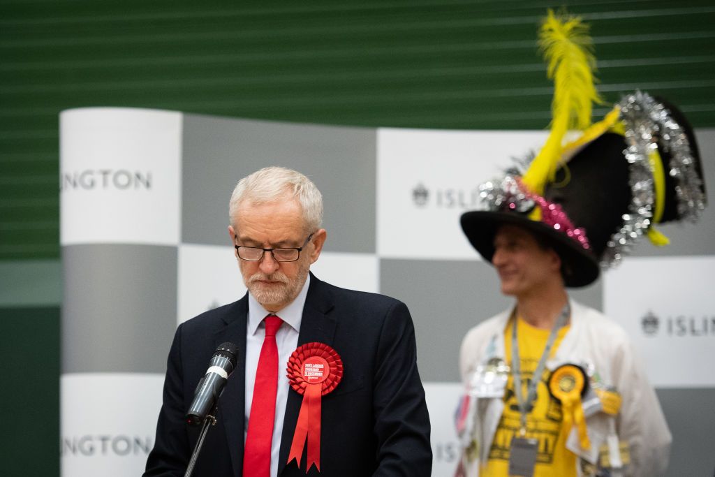 LONDON, ENGLAND - DECEMBER 13: Labour Party leader Jeremy Corbyn (L) speaks from the stage at Sobell leisure centre after retaining his parliamentary seat on December 13, 2019 in London, Engl