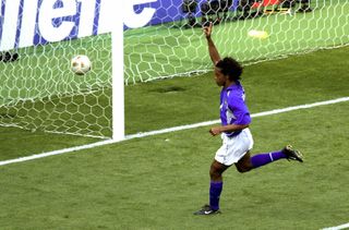 Ronaldinho celebrates after scoring for Brazil against England at the 2002 World Cup.