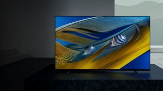 A press shot of the Sony Bravia A80J in a modern living room. 