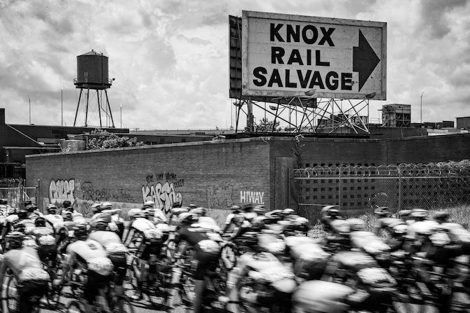The peloton passes by the rail yards during the US Pro Road Race National Championships on June 24, 2018 in Knoxville, Tennessee
