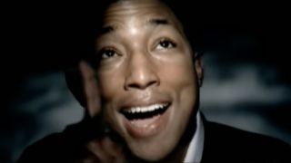 Pharrell Williams singing in the music video for Angel