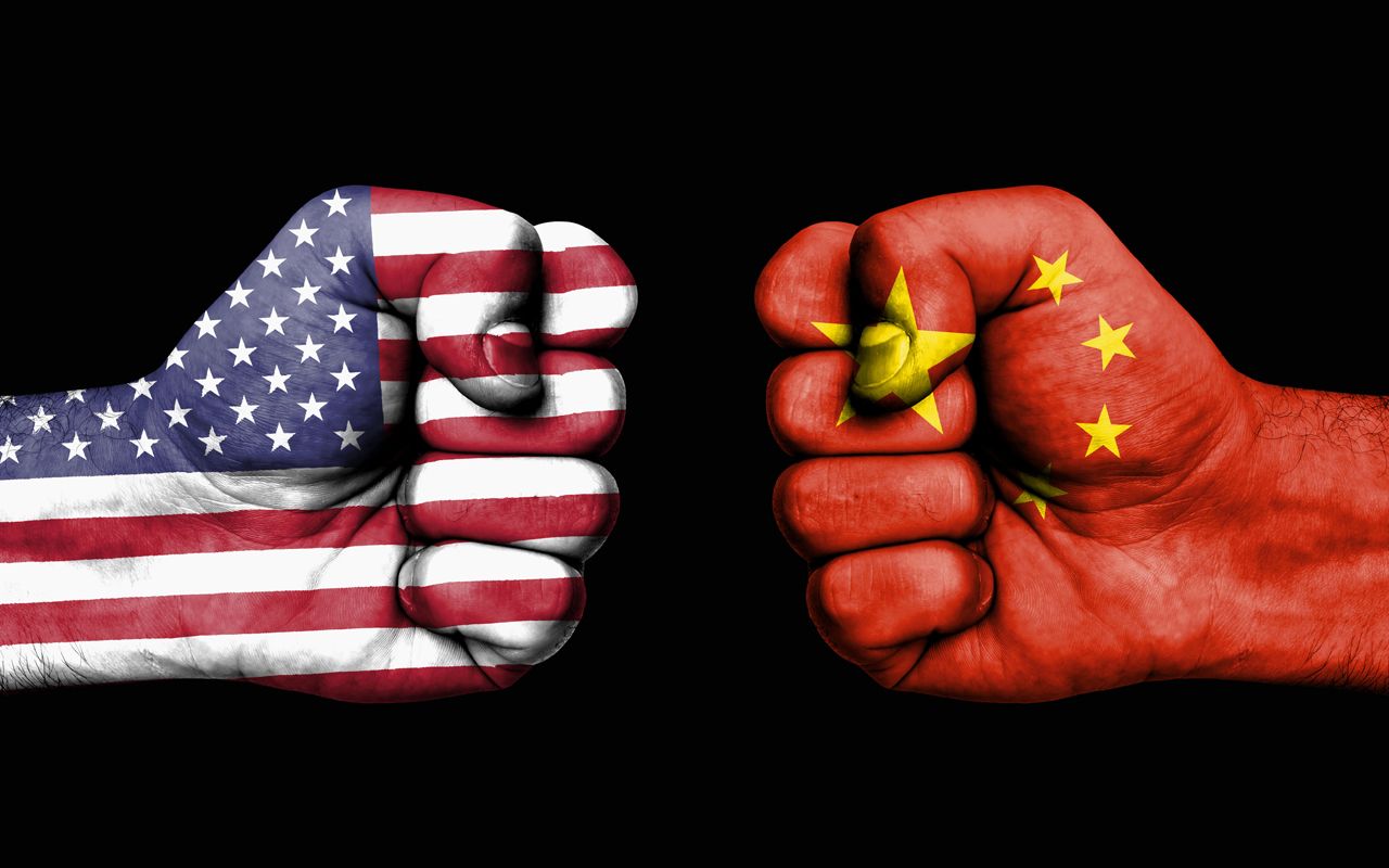 Conflict between USA and China, male fists - governments conflict concept