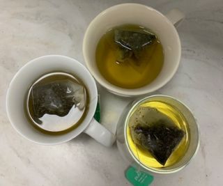 Three mugs of tea, brewed with water from the Aarke Kettle.