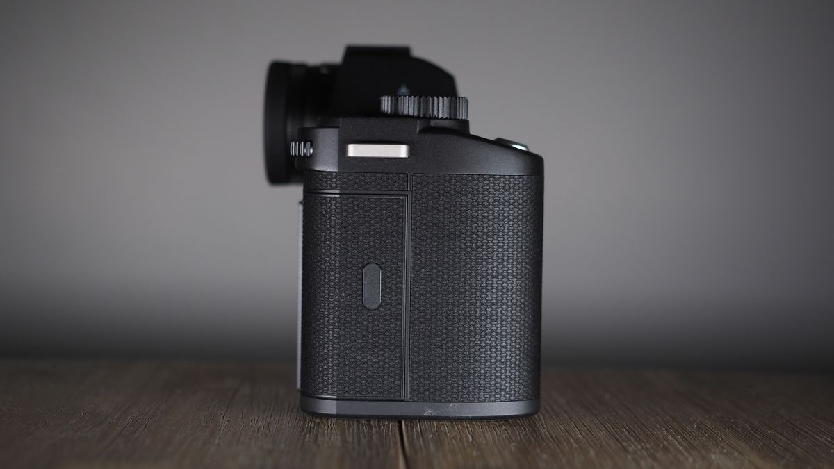 Leica SL3-S on a wooden surface with moody lighting