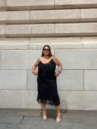 Ana Escalante wearing a black slip dress and silver heels from the J.Crew x Maryam Nassir Zadeh collaboration.