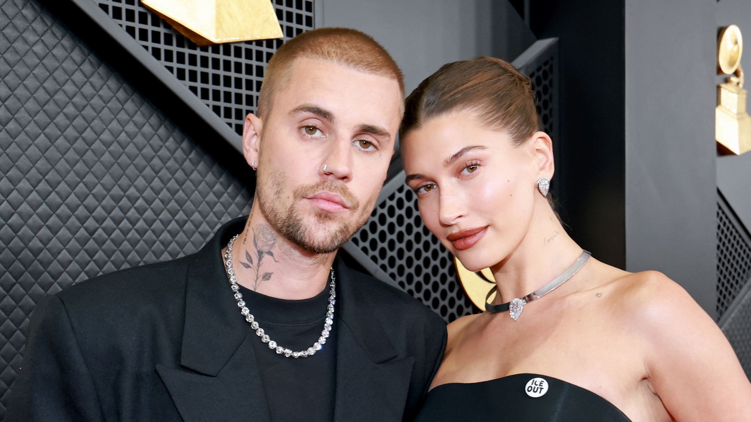 justin bieber and hailey bieber on a black background