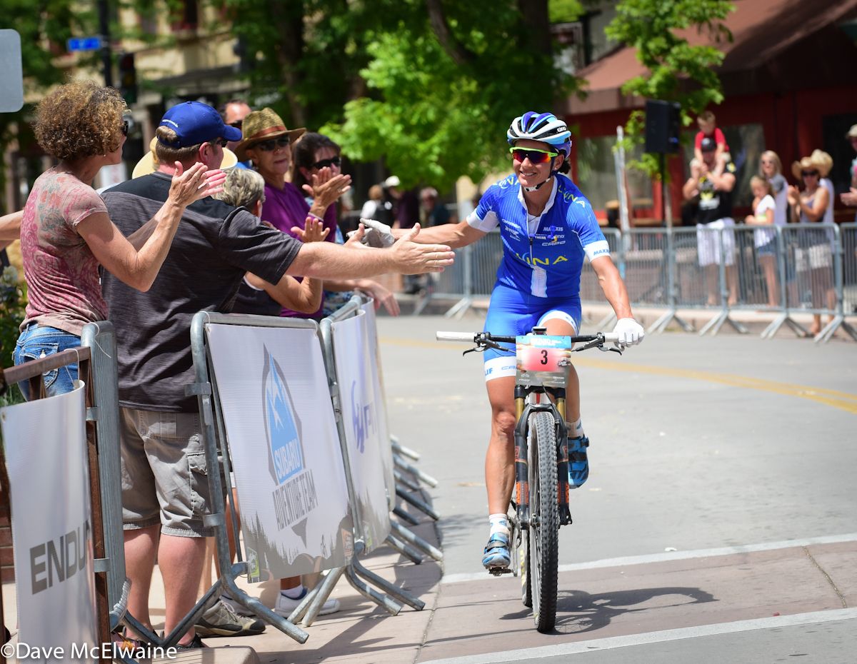 Katerina Nash (Luna Pro Team) is congratulated by the Main Street crowd on her victory