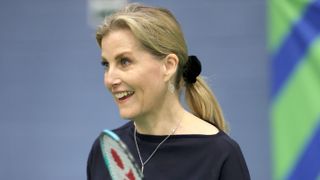 Sophie, Duchess of Edinburgh smiles as she takes part in a badminton match