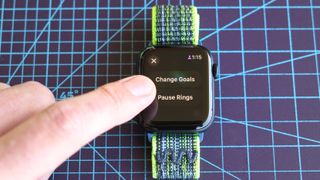 Close-up of the Apple Watch SE 2022 and Apple's Activity app where you can now pause Rings